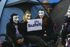 Occupy Protesters Sporting Masks | Photo Courtesy of user Leepower Via Wikimedia Commons