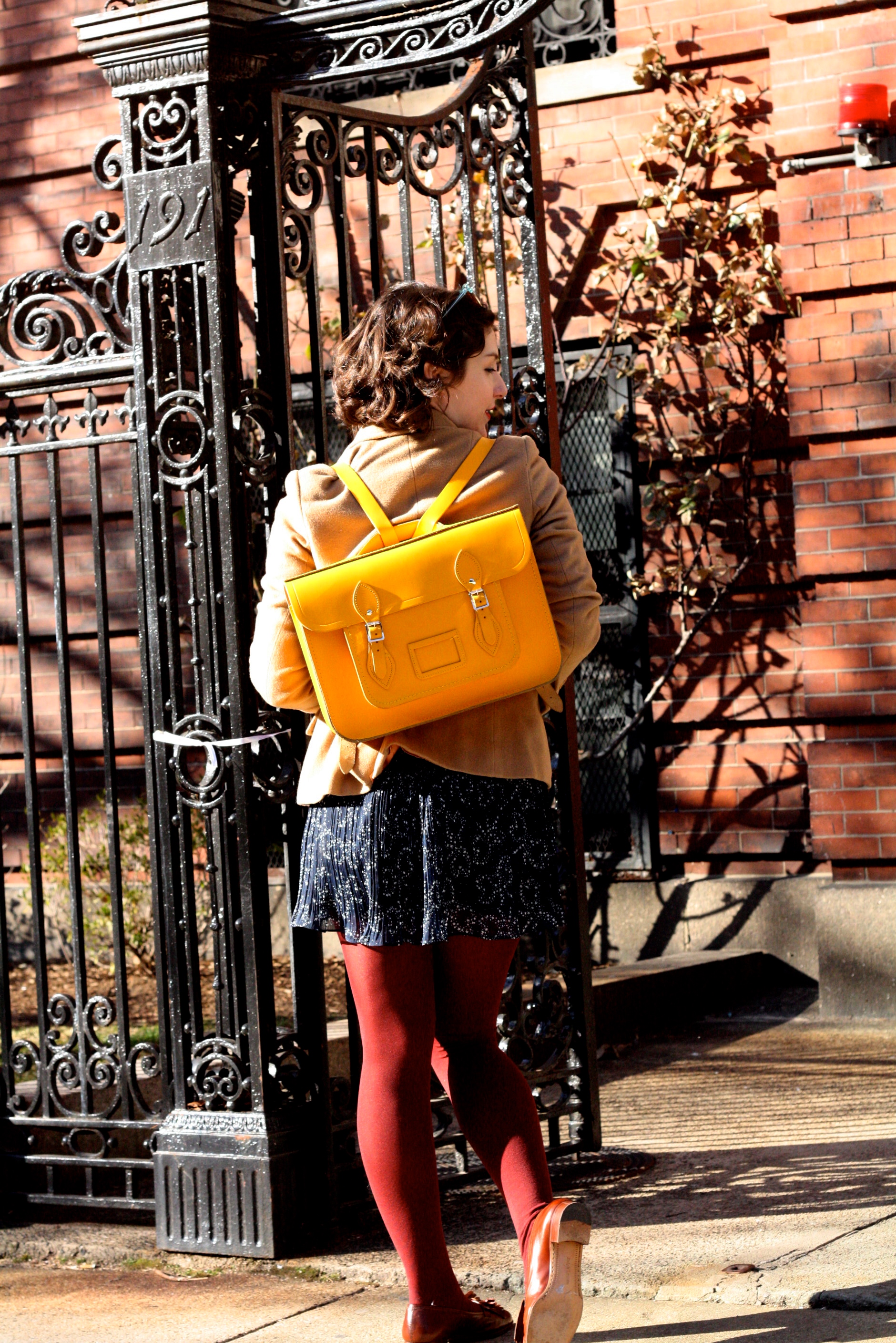 Tights may be too warm, but a yellow backpack is all cool.