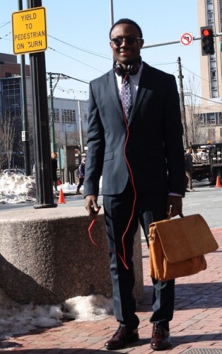 Dang! That is some beautiful menswear. Tewado Latty, SMG '13, rocks a precisely tailored suit with slick shades, a handsome leather attache, and a pop of color from his Beats by Dre headphones. Accessories make the look! Photo by Sharon Weissburg.