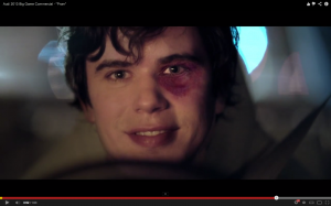 Screen shot from Audi's "Prom" spot featuring a black-eyed and brazen teen.