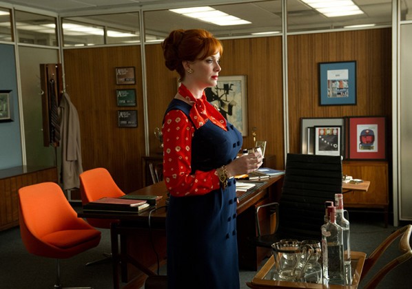 Joan's ensemble here incorporates red and blue, important colors for the episode that discuss the linked themes of guilt and sex. Photo via AMC.
