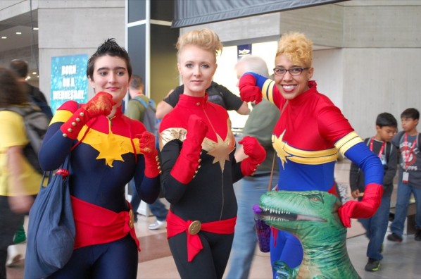 Three Captain Marvel cosplayers representing the Carol Corps