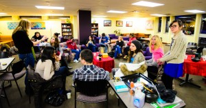 Students conversing during Tea Time at the Howard Thurman Center at BU. 