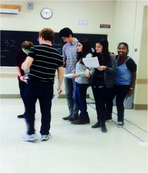 Stage Troupe actors work on blocking a scene during rehearsal. | Photo by Morgan Lehofer