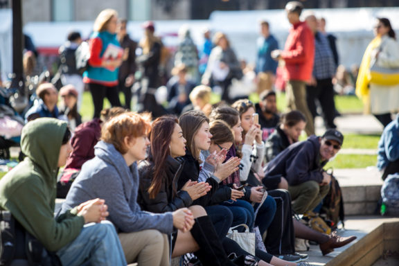 Attendees enjoy a show on the Berklee Stage at the outdoor fair of the Boston Book Festival Saturday afternoon. Local bands performed throughout the day.