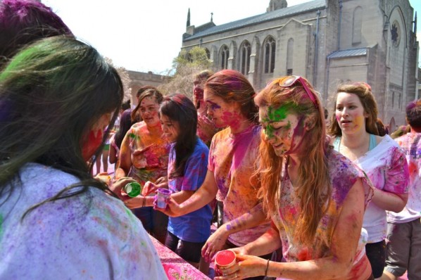 Students line up to receive allotments of colored powder during last year's Holi celebrations at the BU Beach. | Photo courtesy of the Hindu Students Council