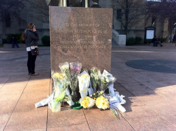 Flowers left for Lu Lingzi at the base of BU's Martin Luther King, Jr. memorial. | Photo by Allan Lasser